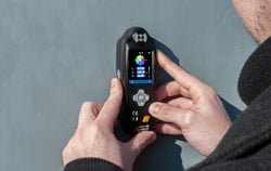 Colorimeter PCE-XXM 20 in use to check a wall color.