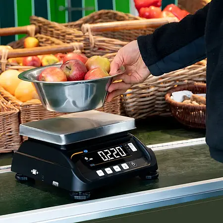 Geijkte weegschaal in gebruik