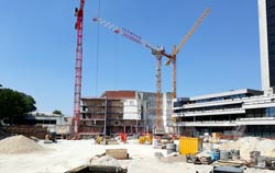 At large construction site a wind speed meter mounted on crane transmit wireless data to an evaluation unit.