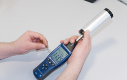 PCE-SC 42 calibrator for sound level meters in use.
