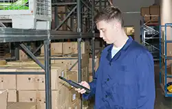 Humidity meter PCE-330 in use in a warehouse.