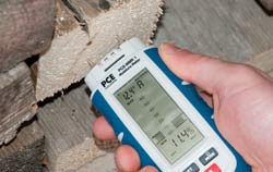 Wood Moisture Meter at a application for checking firewood.