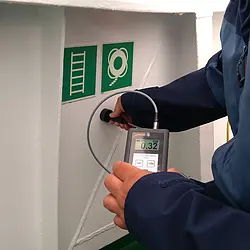 Thickness gauge during the application on a ship.